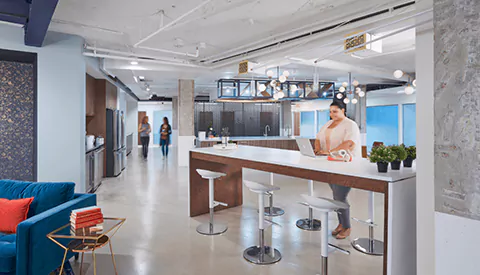 A modern office with a bar in the middle of the room. Workplace in Dupont Circle | 1250 Connecticut Ave NW, 7th Floor Washington, DC 20036