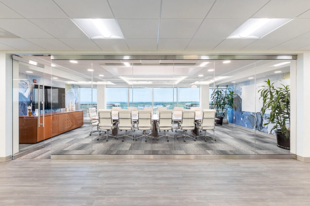 MetroOffices Fairfax Conference 3 1 - Metro Offices A home conference room with glass wall and chairs.